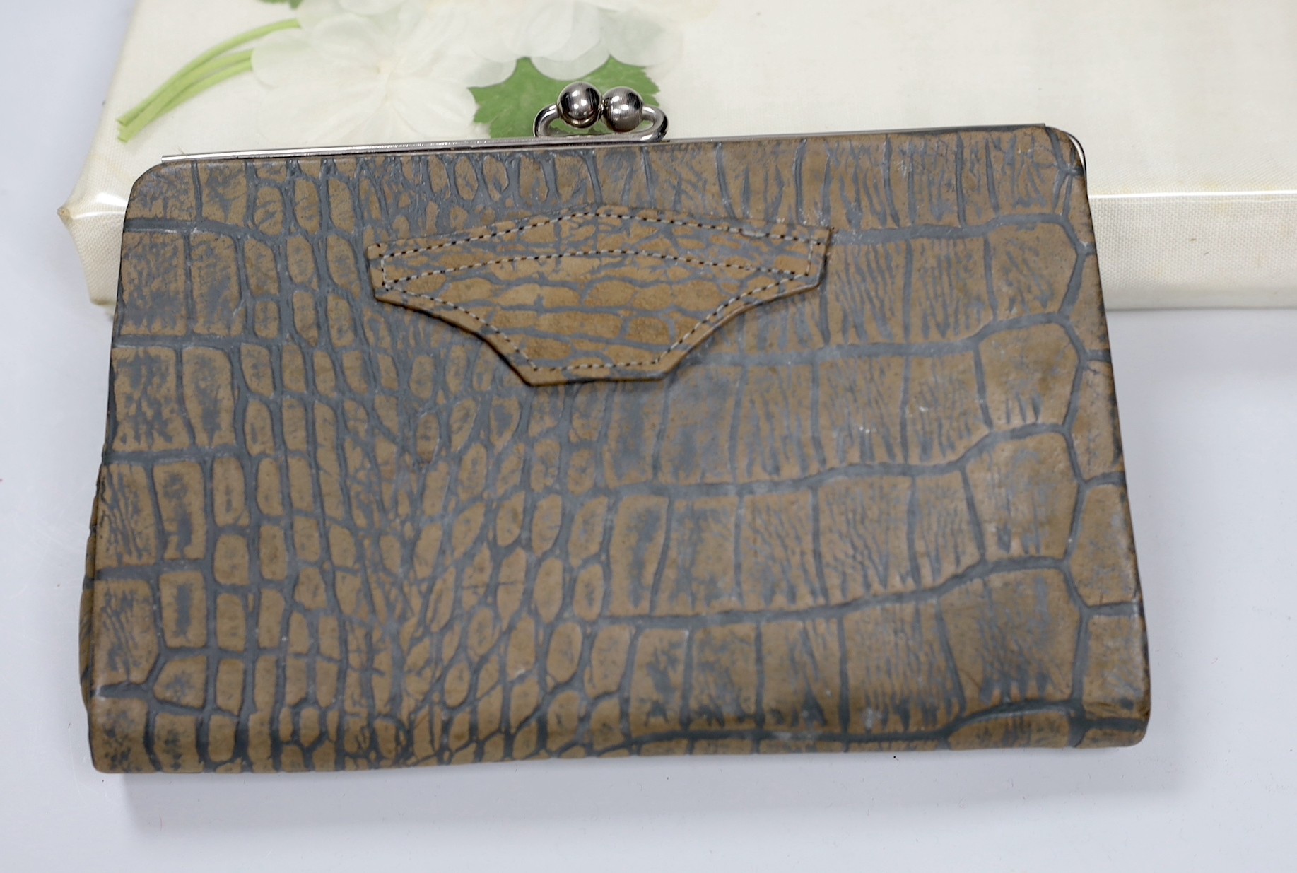 Two 1960's gilt metal ladies evening bags, a metal and wooden bag, a 1950's plastic and fabric bag possibly American, a 1930's faux crocodile clutch bag and a 1930's stripe clutch bag